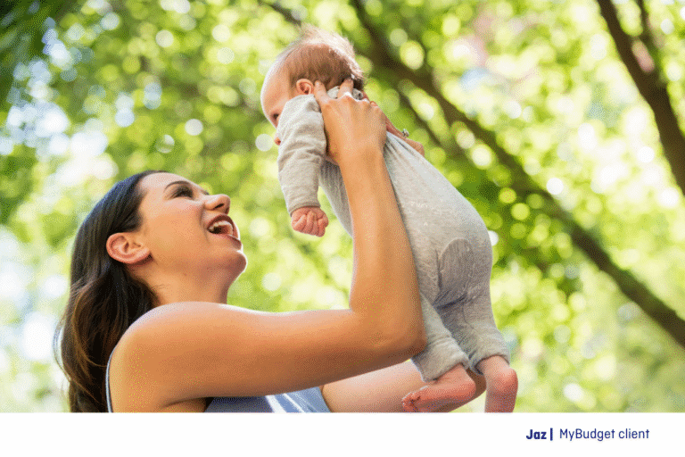 Jaz, a MyBudget client, holding her newborn baby in a sunny park. Mother’s Day 2026 is made simple with our top gift idea list for every budget.