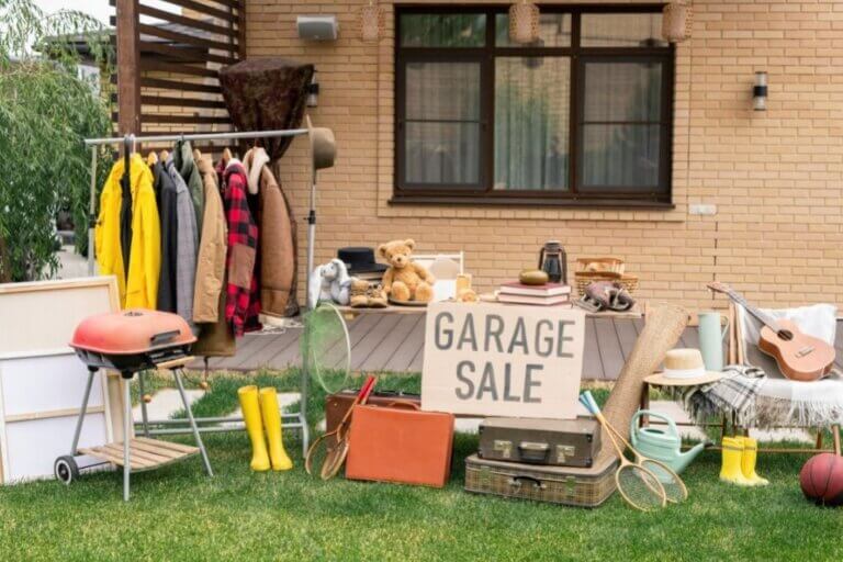 Garage sale taking place in front of a house